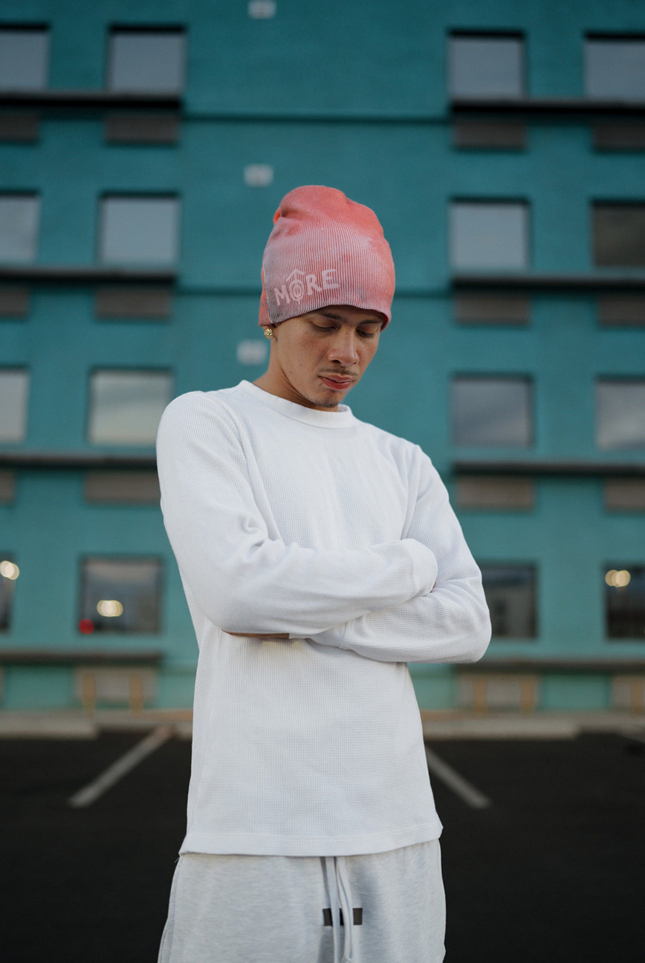 Man wearing an Red beanie with the word 